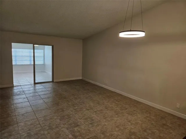 a kitchen with a refrigerator stove and microwave
