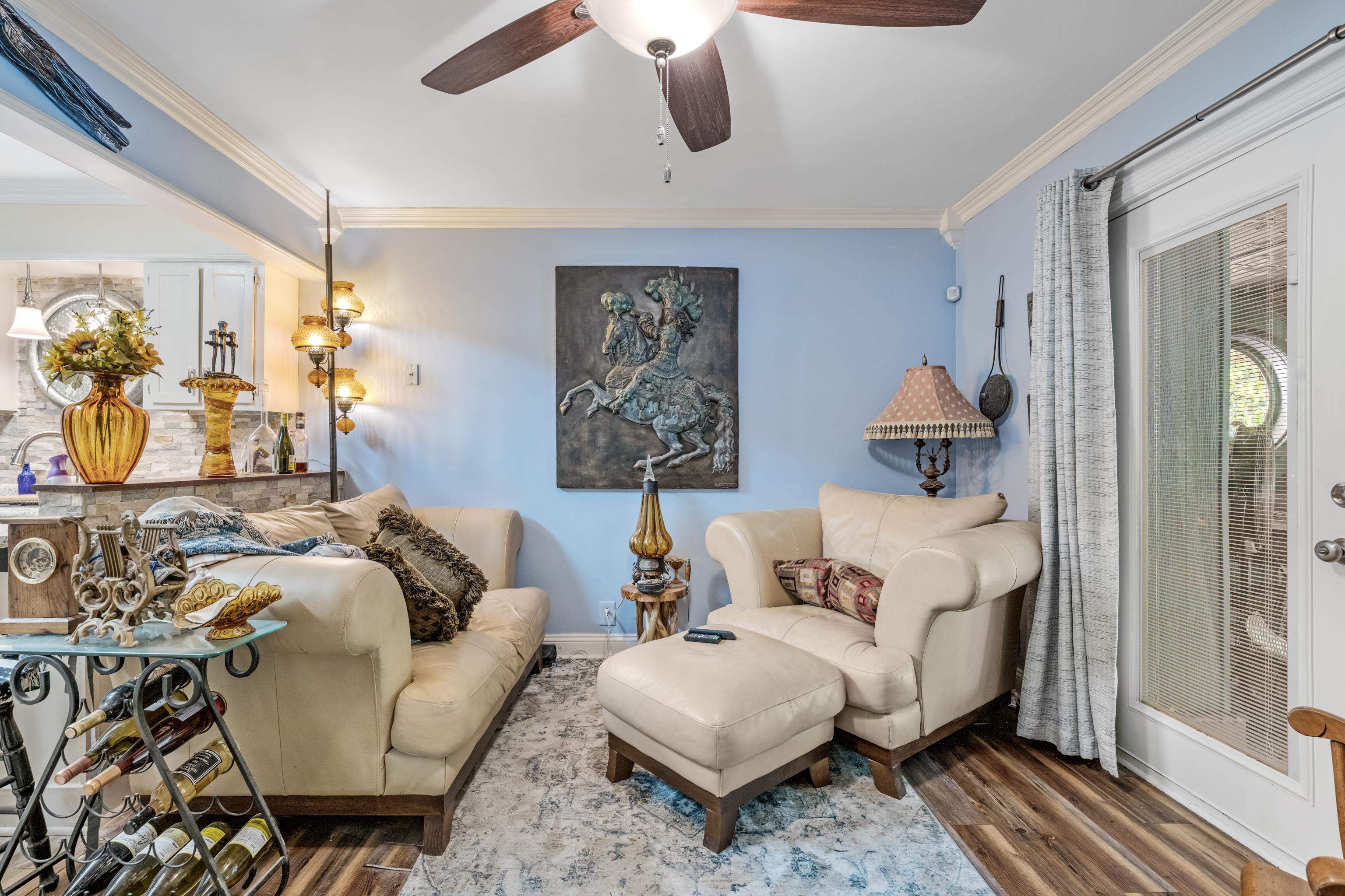 5921 Benjestown Road Memphis, TN 38127 - Photo 24 of 36 Living room featuring ornamental molding, wood finished floors, and a ceiling fan