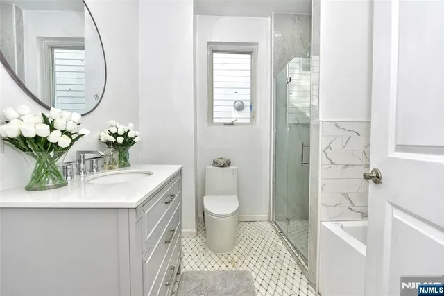 a bathroom with a bathtub and a shower