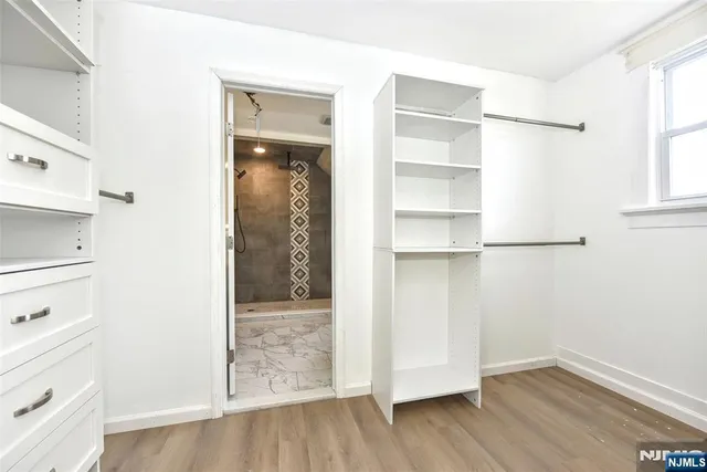 a bathroom with a toilet sink and shower