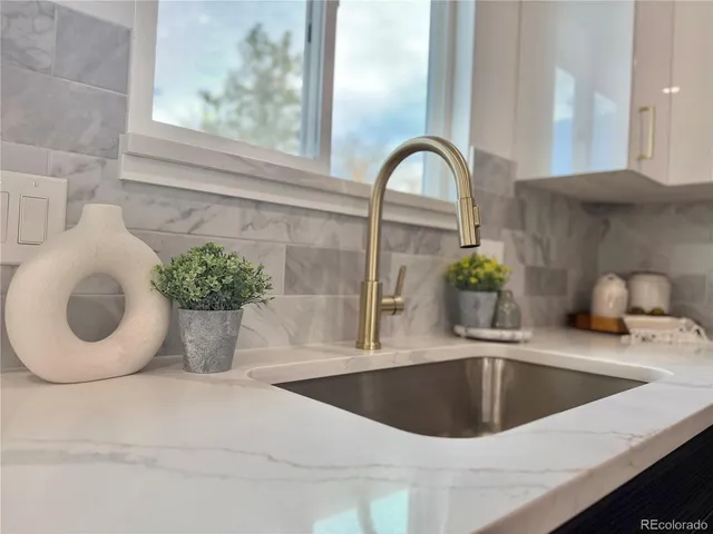a kitchen with a sink and a window