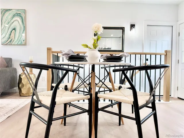 a view of a chairs and table in kitchen