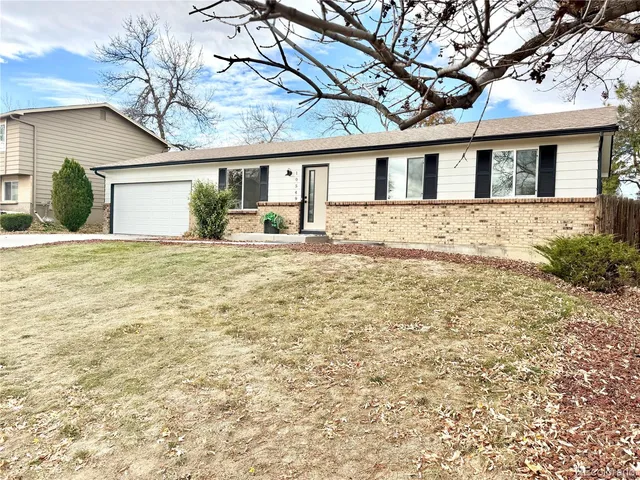 a front view of a house with yard