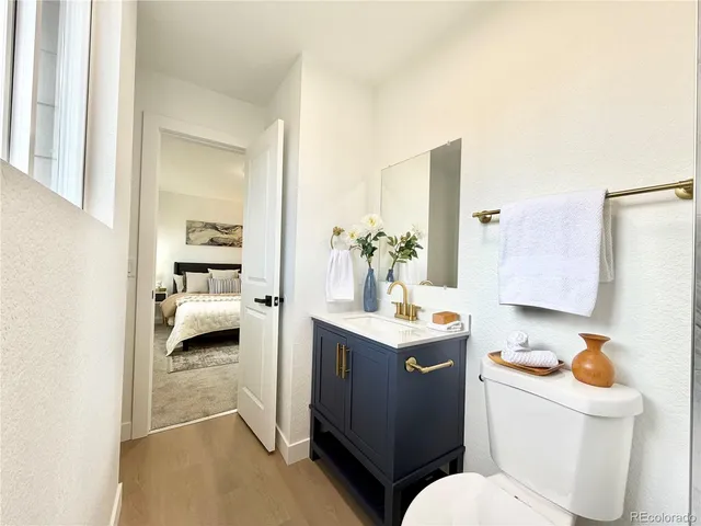 a en suite bathroom with a toilet sink and mirror