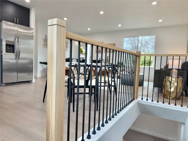 a view of staircase with lots of wooden floor and windows