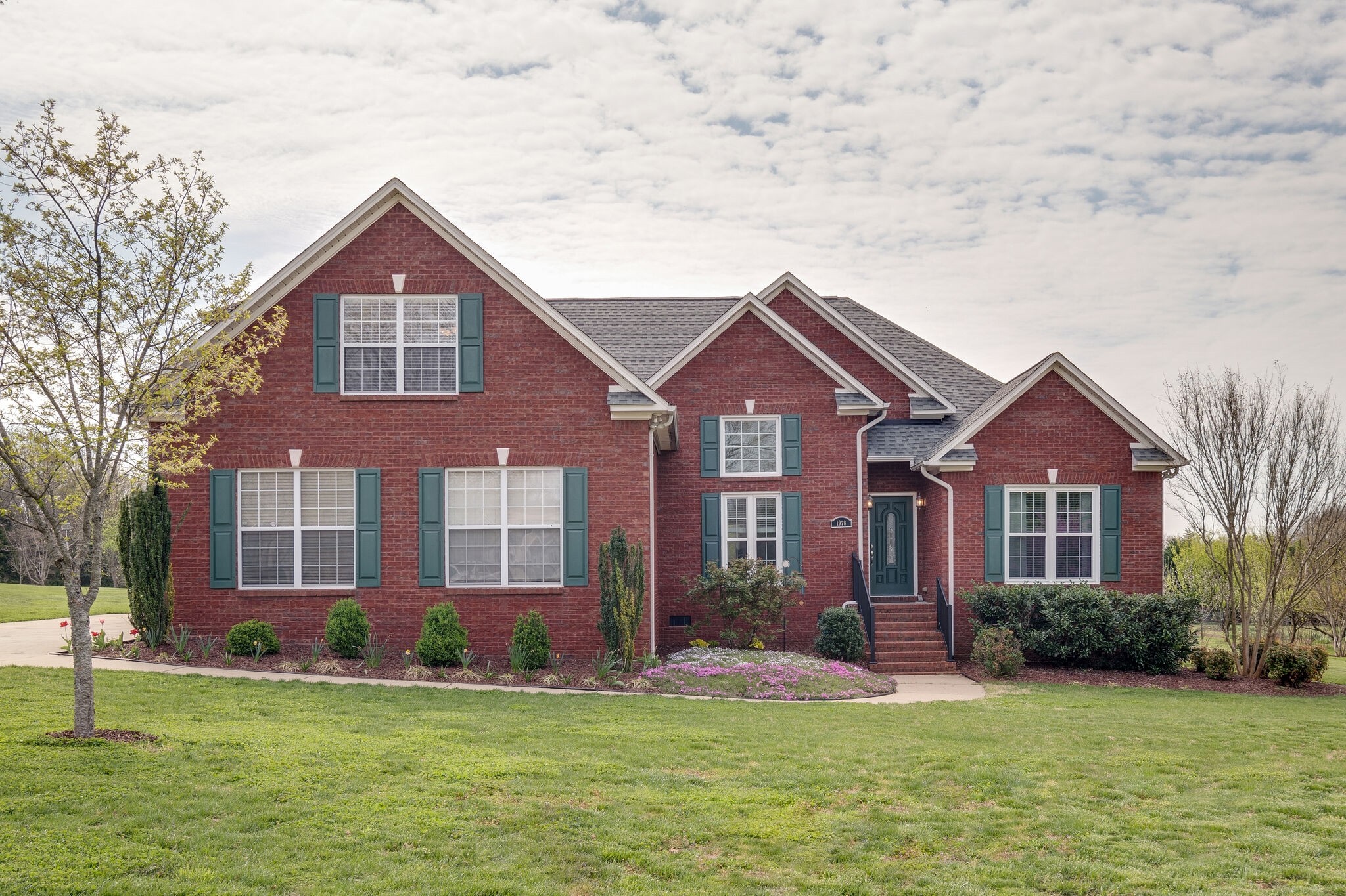 1978 Lasea Road Spring Hill, TN 37174 - Photo 1 of 31 a front view of a house with a yard