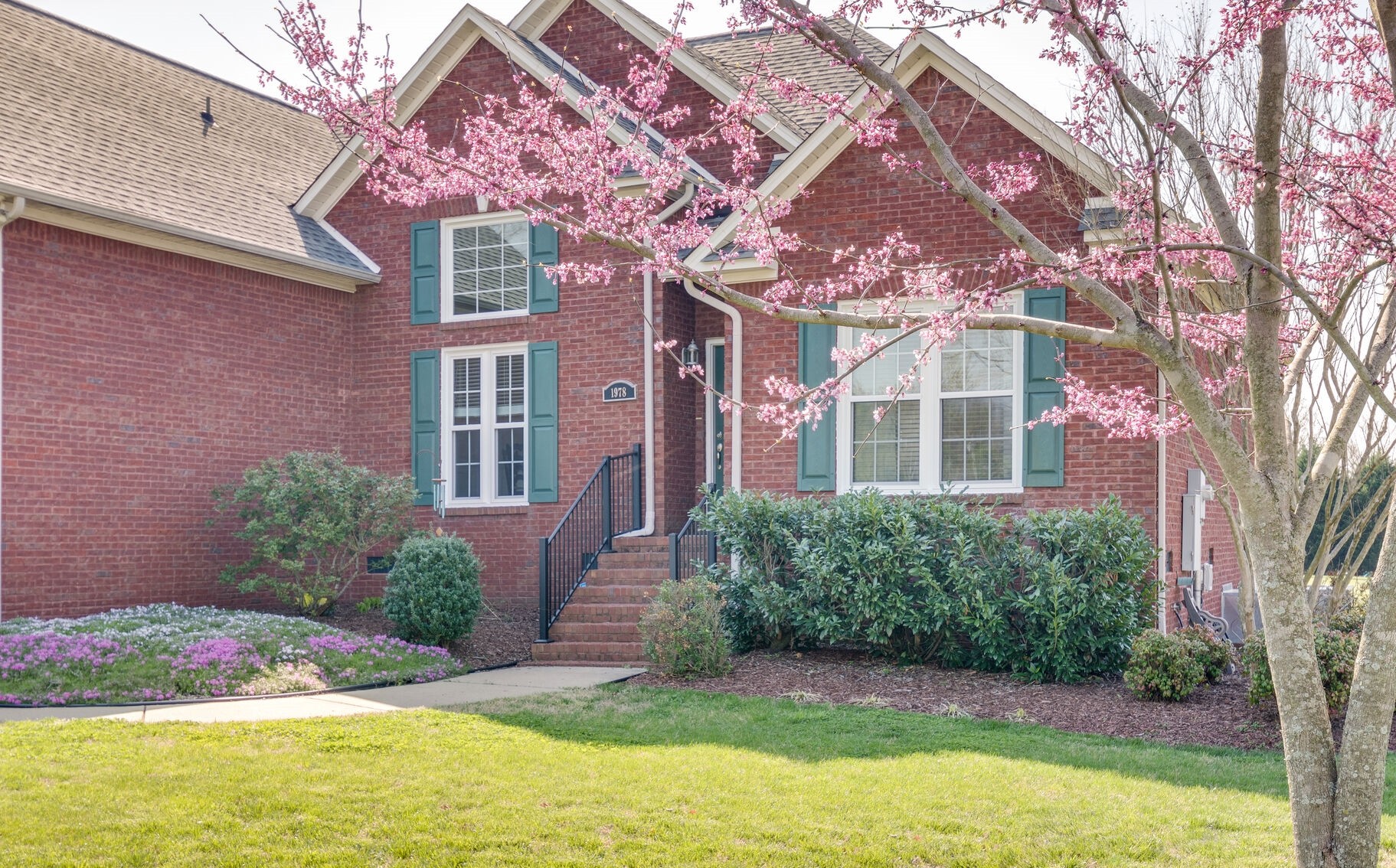1978 Lasea Road Spring Hill, TN 37174 - Photo 3 of 31 a front view of a house with garden