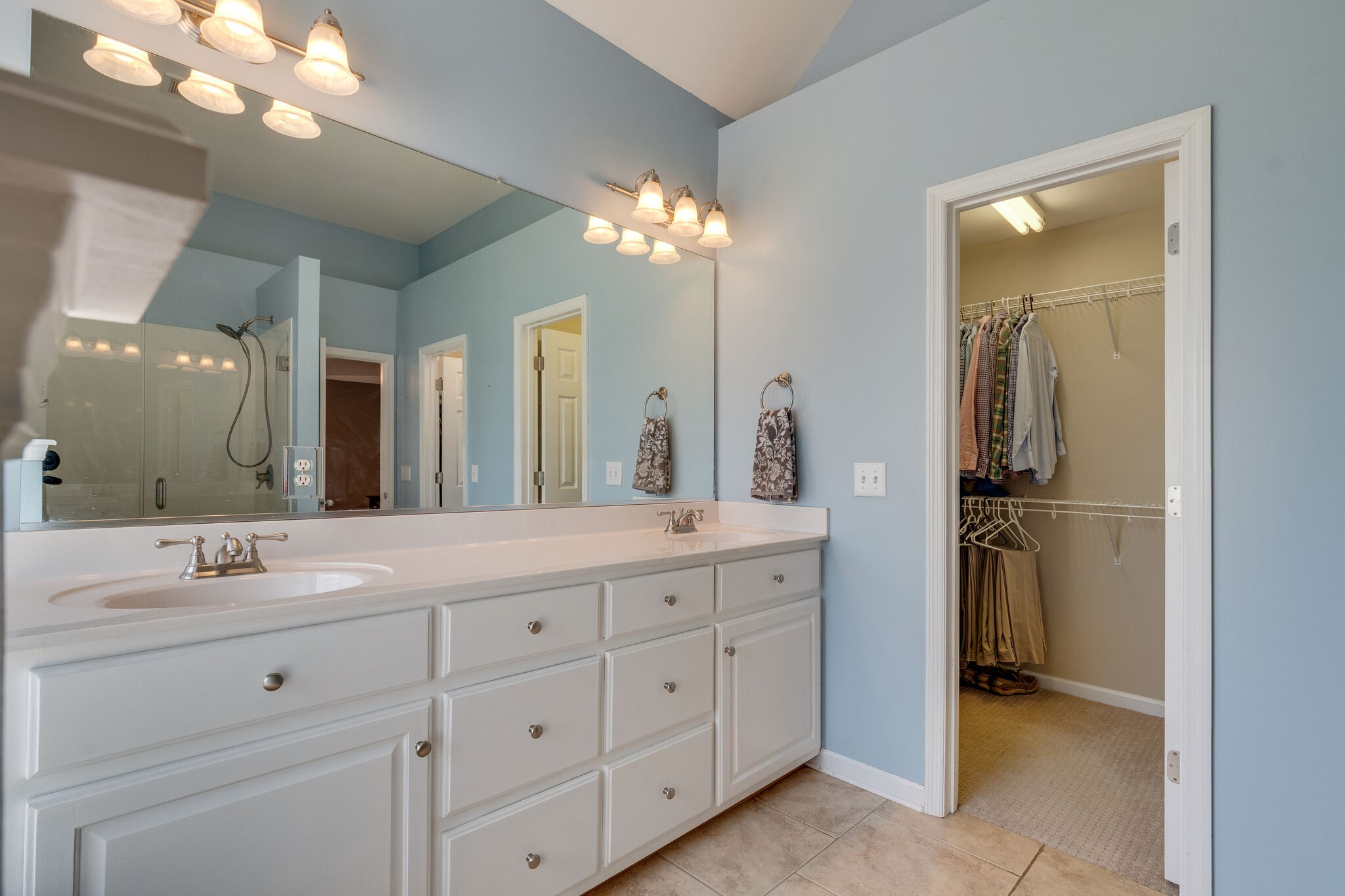 1978 Lasea Road Spring Hill, TN 37174 - Photo 21 of 31 a bathroom with a double vanity sink and a mirror