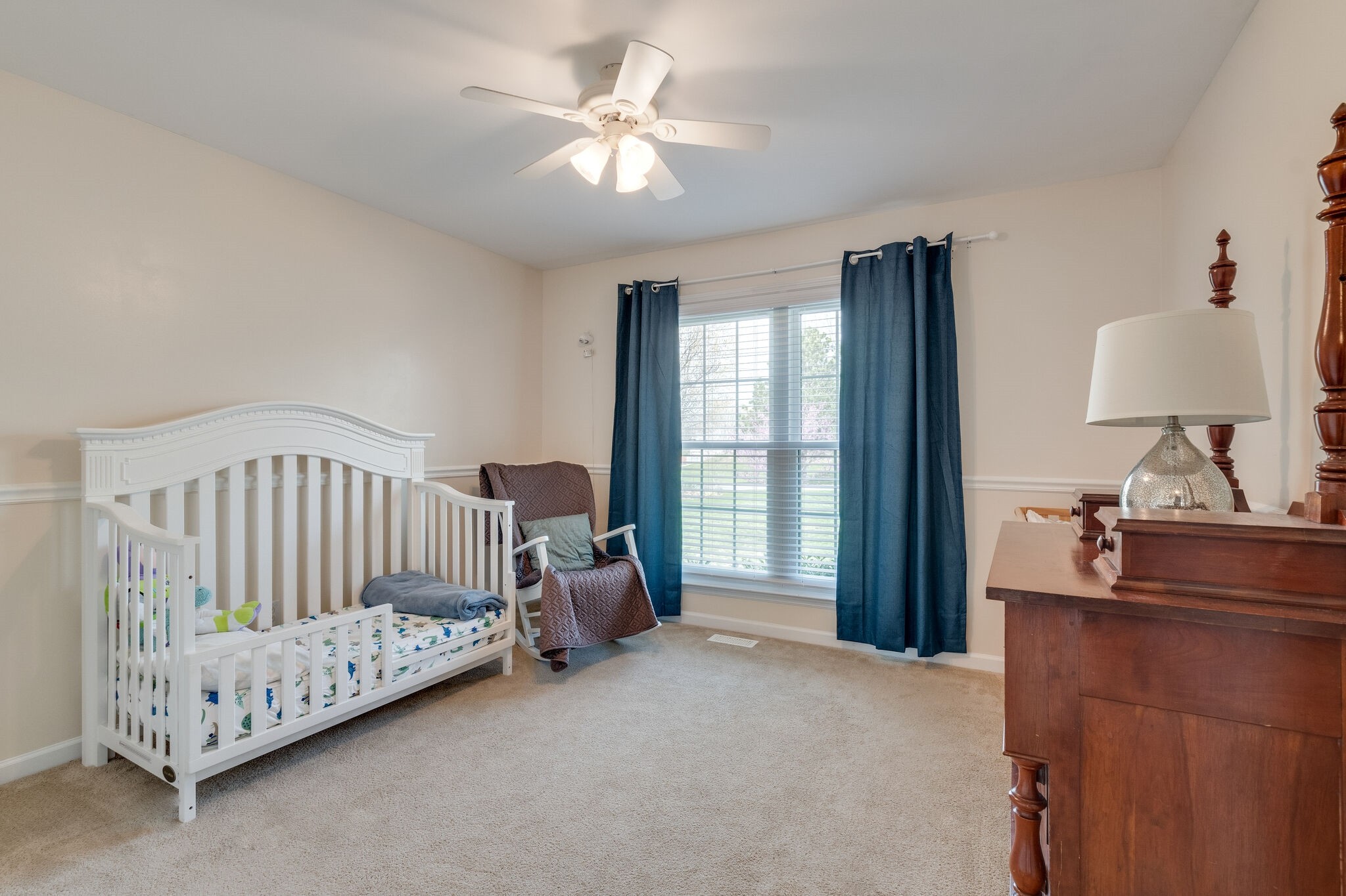 1978 Lasea Road Spring Hill, TN 37174 - Photo 23 of 31 a bed sitting in a bedroom next to a window