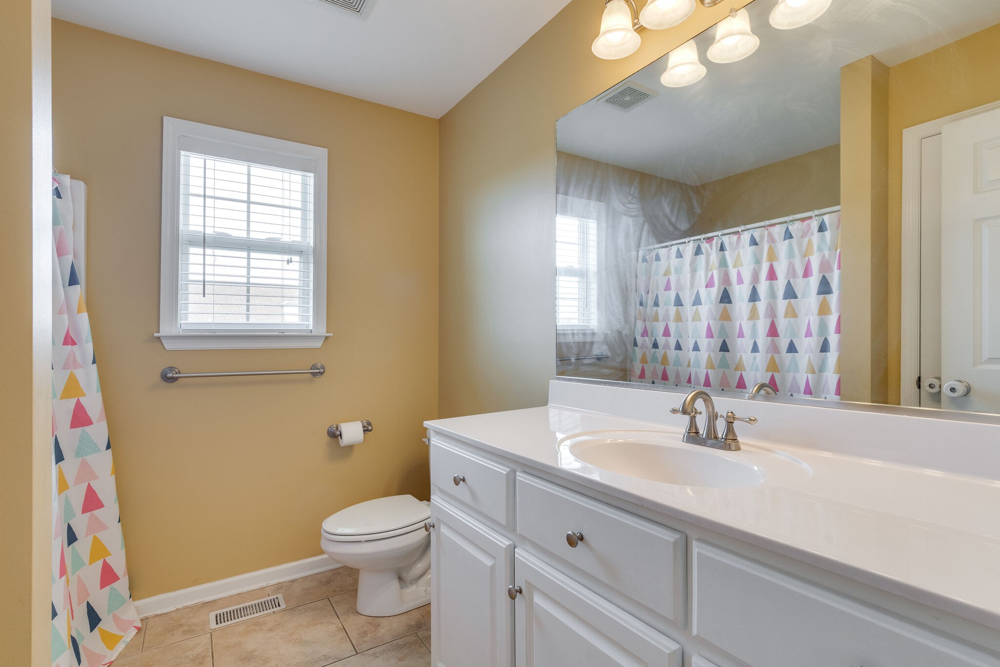 1978 Lasea Road Spring Hill, TN 37174 - Photo 24 of 31 a bathroom with a sink a toilet and a mirror