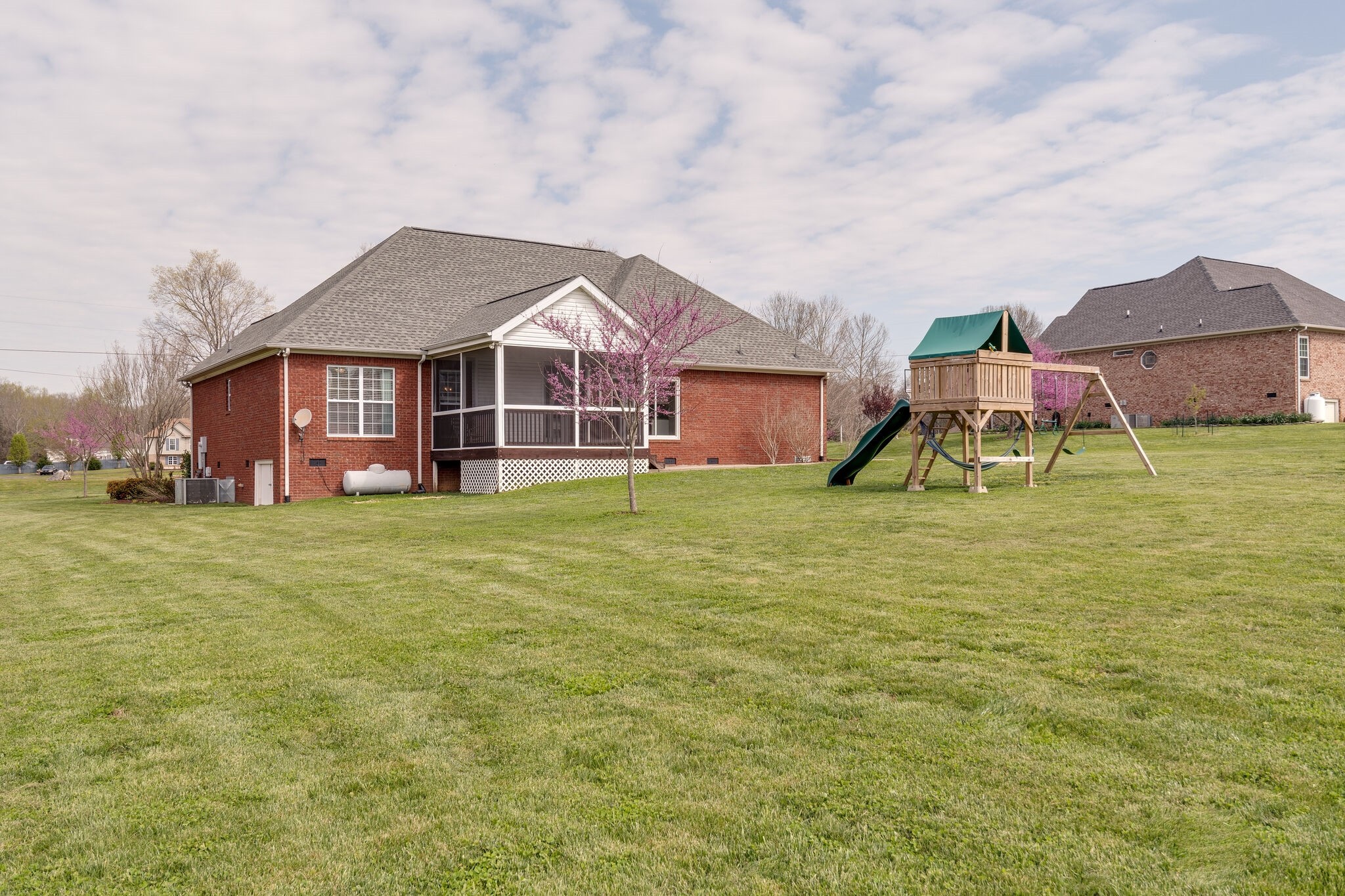 1978 Lasea Road Spring Hill, TN 37174 - Photo 30 of 31 a view of a house with a big yard and large trees
