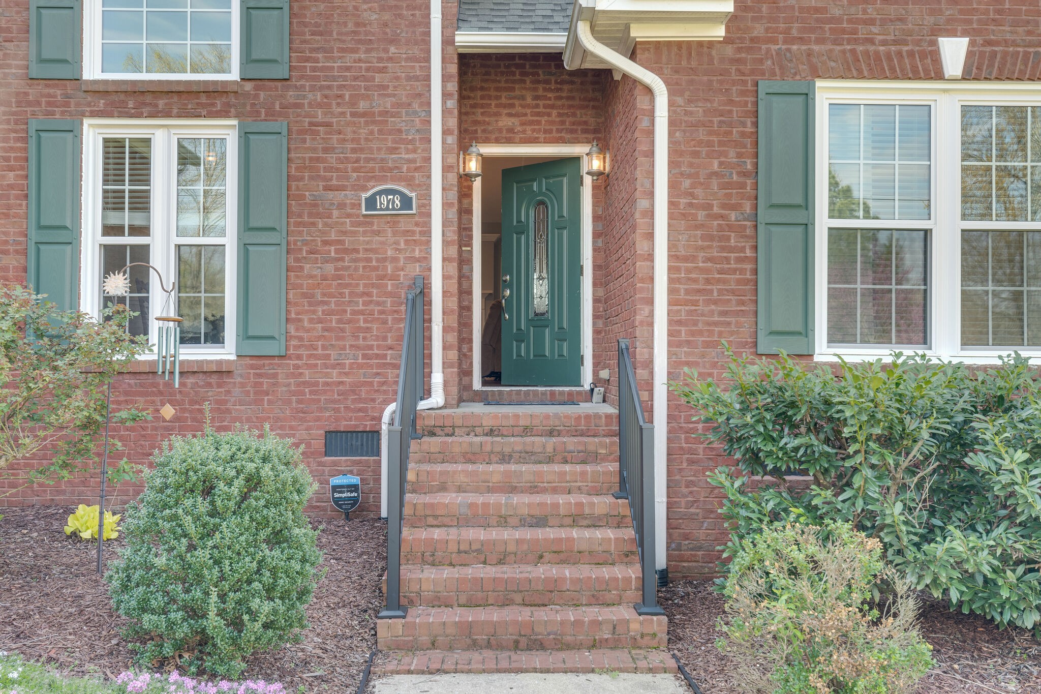 1978 Lasea Road Spring Hill, TN 37174 - Photo 5 of 31 a front view of a house with a garden