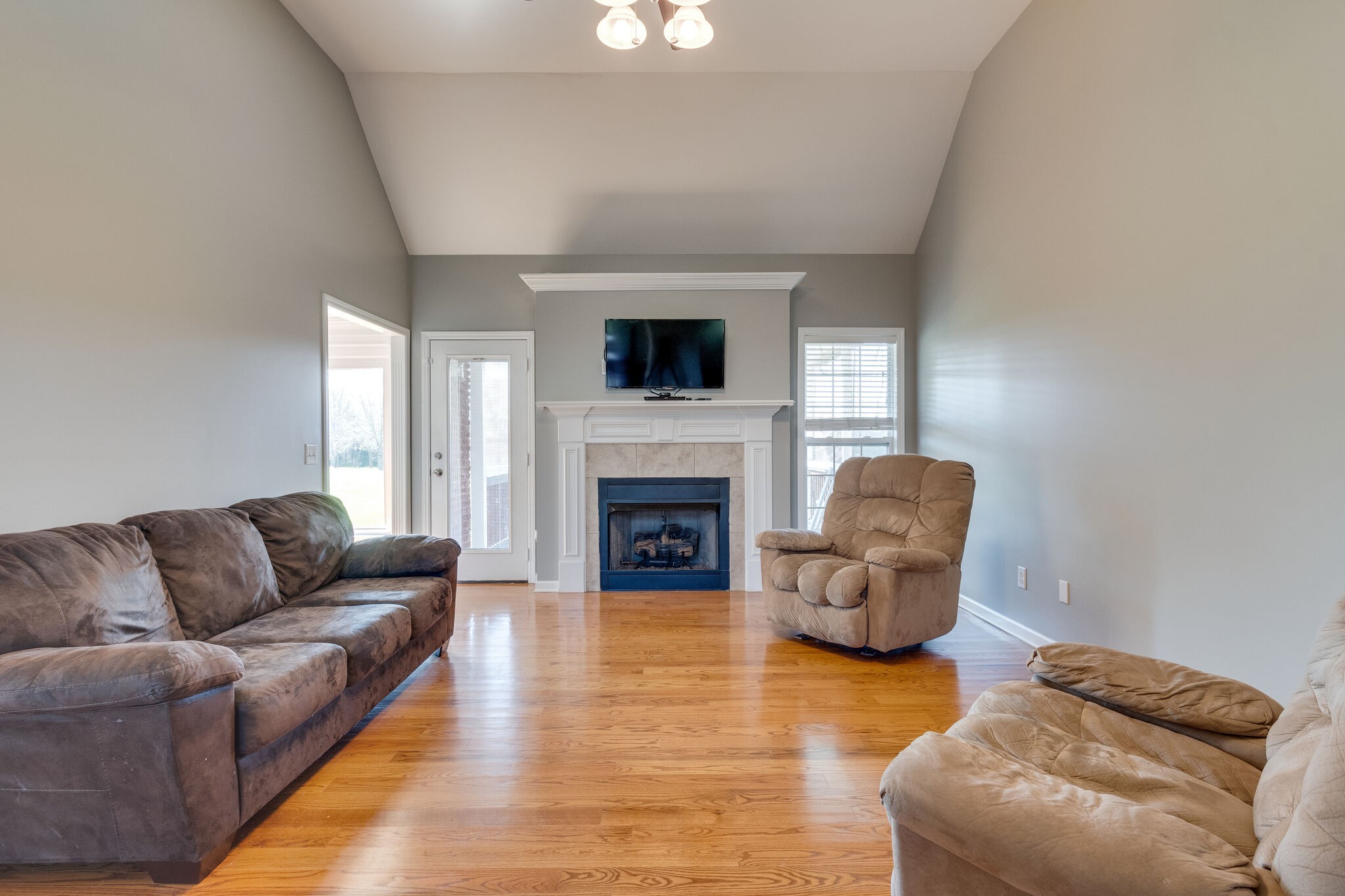 1978 Lasea Road Spring Hill, TN 37174 - Photo 10 of 31 a living room with furniture and a fireplace