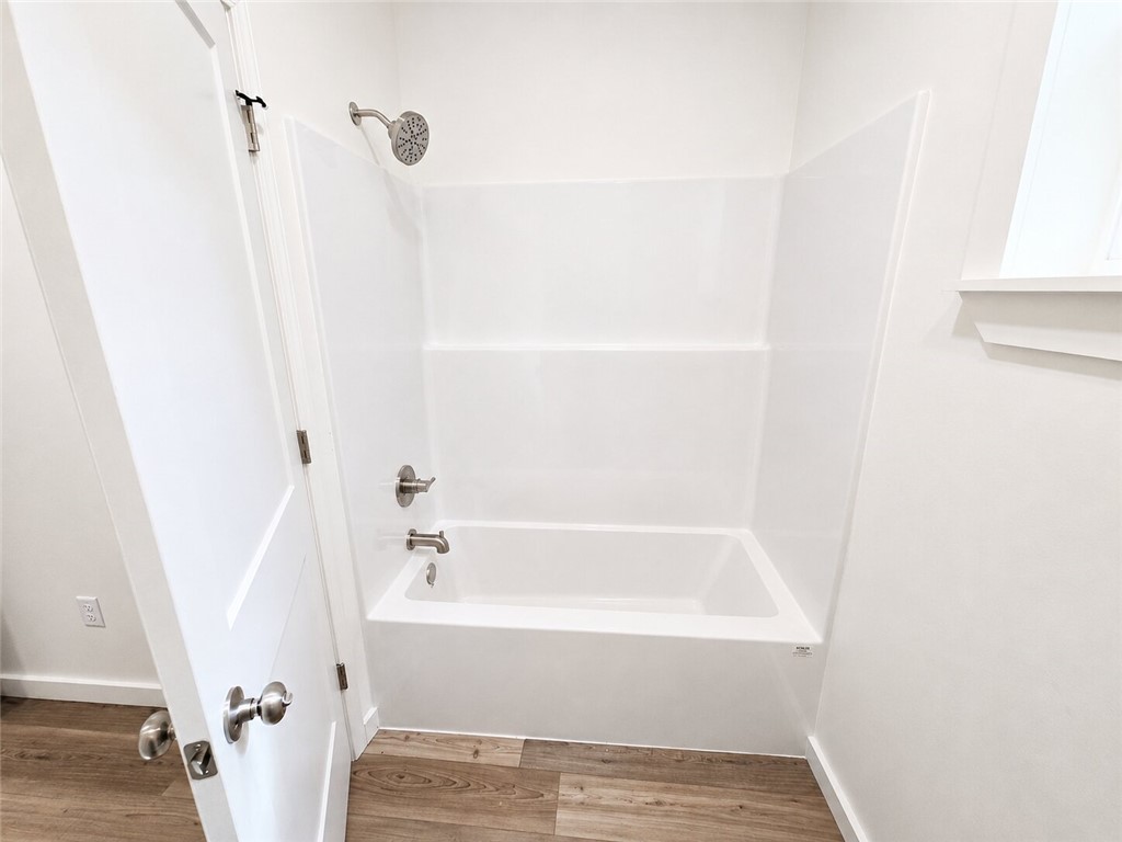 331 Channel Circle Russellville, AR 72802 - Photo 26 of 29 Clean white tub and shower combination with brushed nickel fixtures