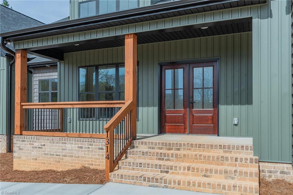1314 Riverside Drive Lexington, NC 27292 - Photo 2 of 41 Stained wood with black railings, View of High Rock Lake
