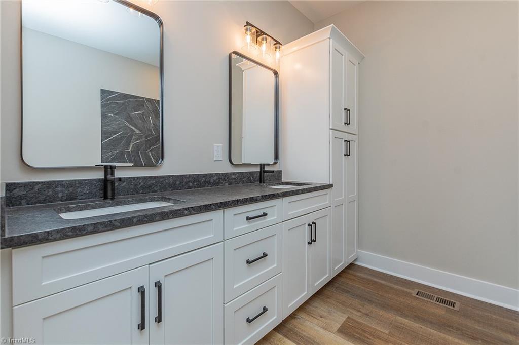 1314 Riverside Drive Lexington, NC 27292 - Photo 21 of 41 His/Hers sinks. Linen cabinet