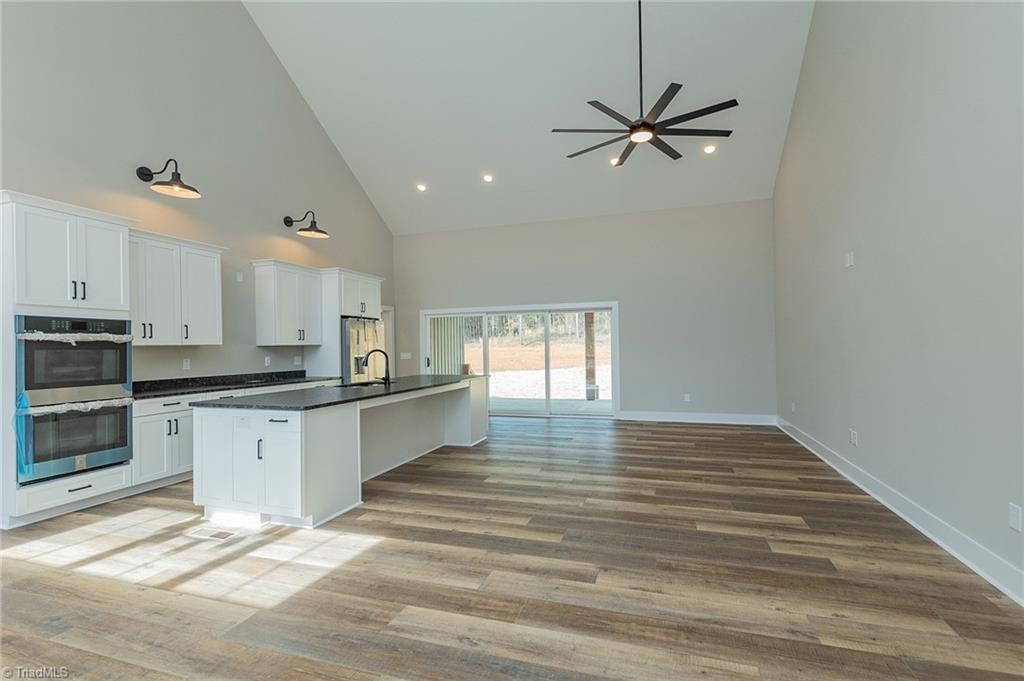 1314 Riverside Drive Lexington, NC 27292 - Photo 4 of 41 Open and cathedral ceilings. All Laminate wood floors through out. Not one piece of carpet in this home.