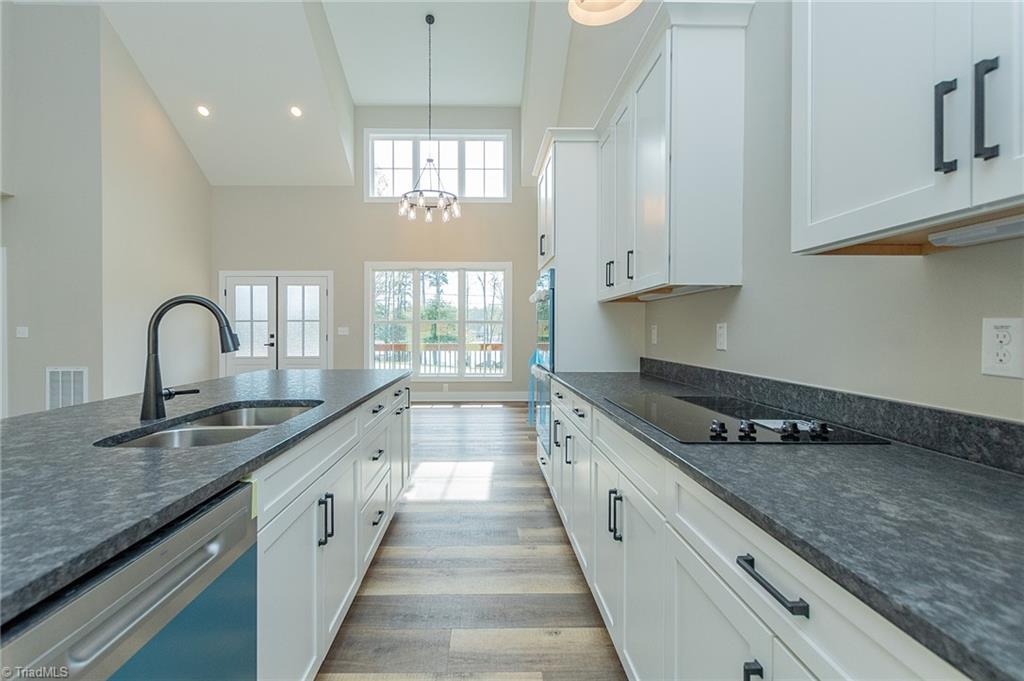 1314 Riverside Drive Lexington, NC 27292 - Photo 9 of 41 Granite counter tops, under cabinet lighting. Soft close cabinets and drawers. Microwave cabinet ready for you to install.
