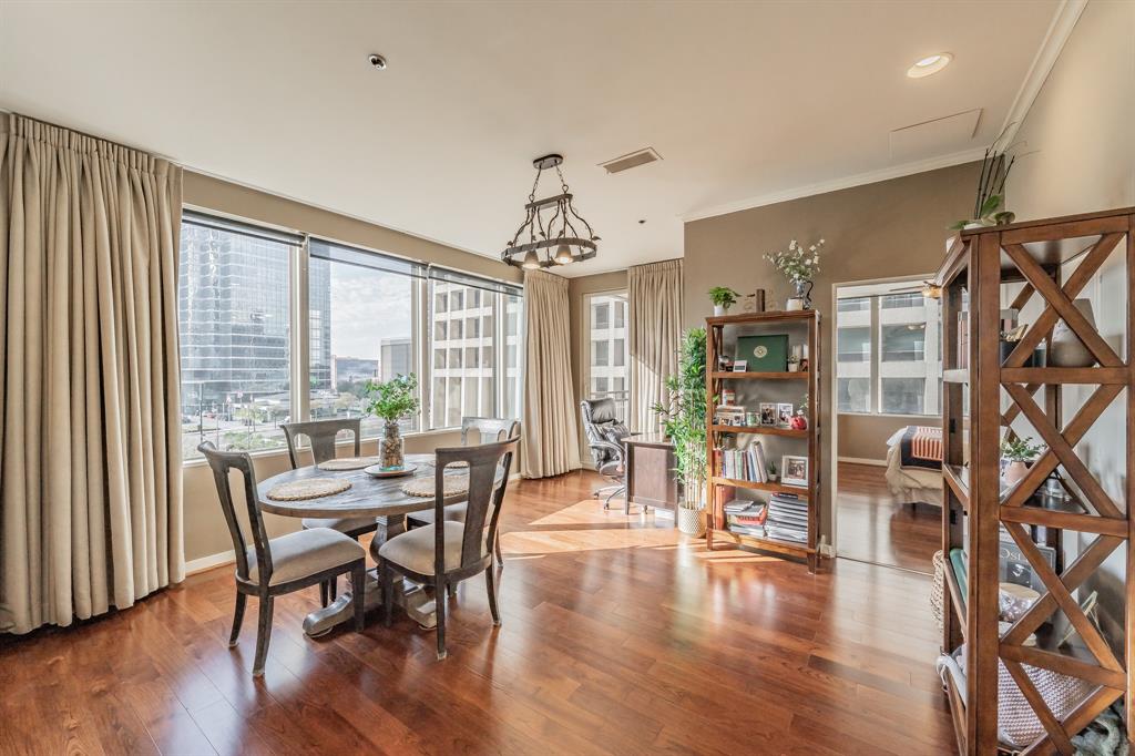 1200 Main Street, Unit 306 Dallas, TX 75202 - Photo 12 of 35 a view of a dining room with furniture window and wooden floor