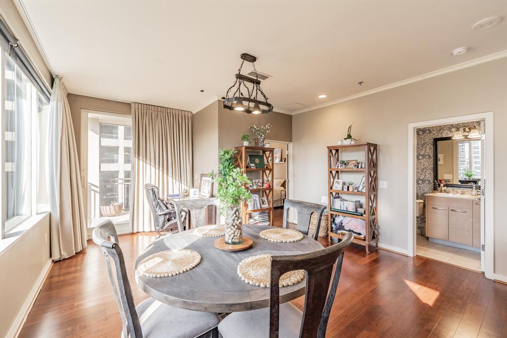 1200 Main Street, Unit 306 Dallas, TX 75202 - Photo 13 of 35 a view of a dining room with furniture window and wooden floor