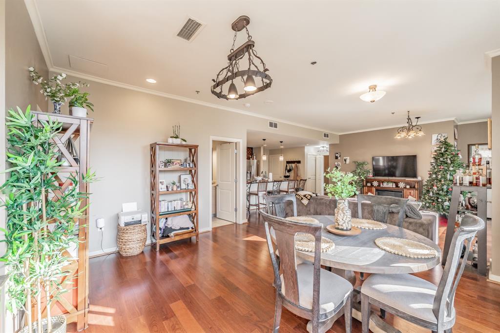 1200 Main Street, Unit 306 Dallas, TX 75202 - Photo 14 of 35 a view of a dining room with furniture window and wooden floor