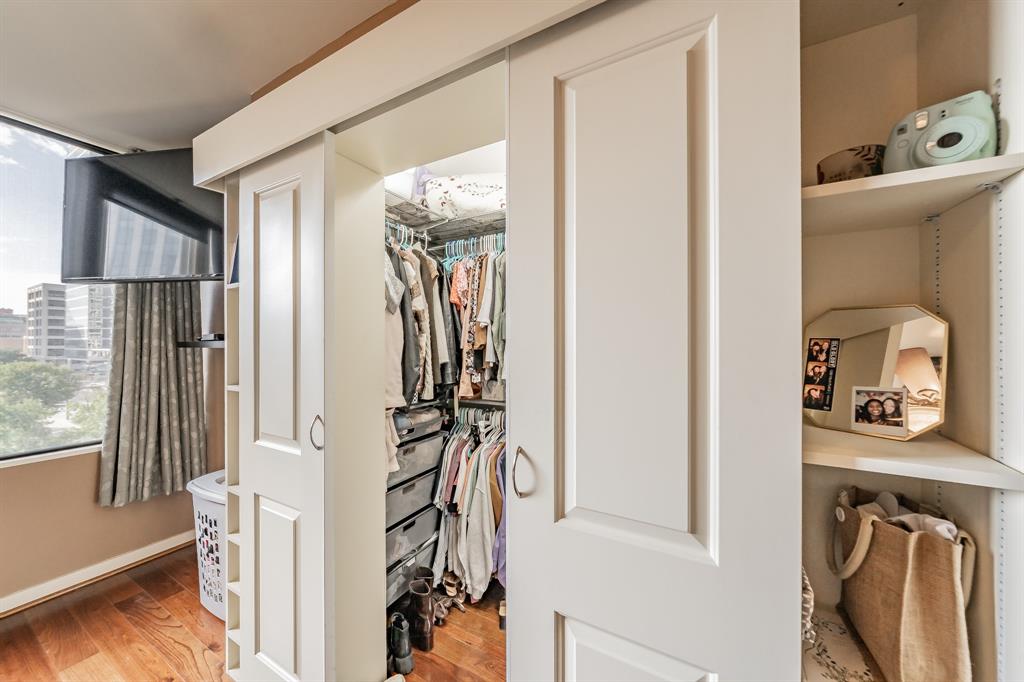 1200 Main Street, Unit 306 Dallas, TX 75202 - Photo 19 of 35 a view of walk in closet with clothes and shoes