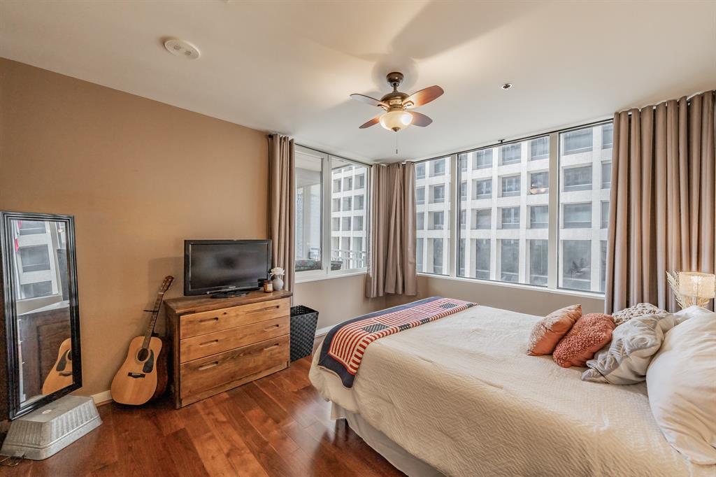 1200 Main Street, Unit 306 Dallas, TX 75202 - Photo 24 of 35 a bedroom with a bed television and a window