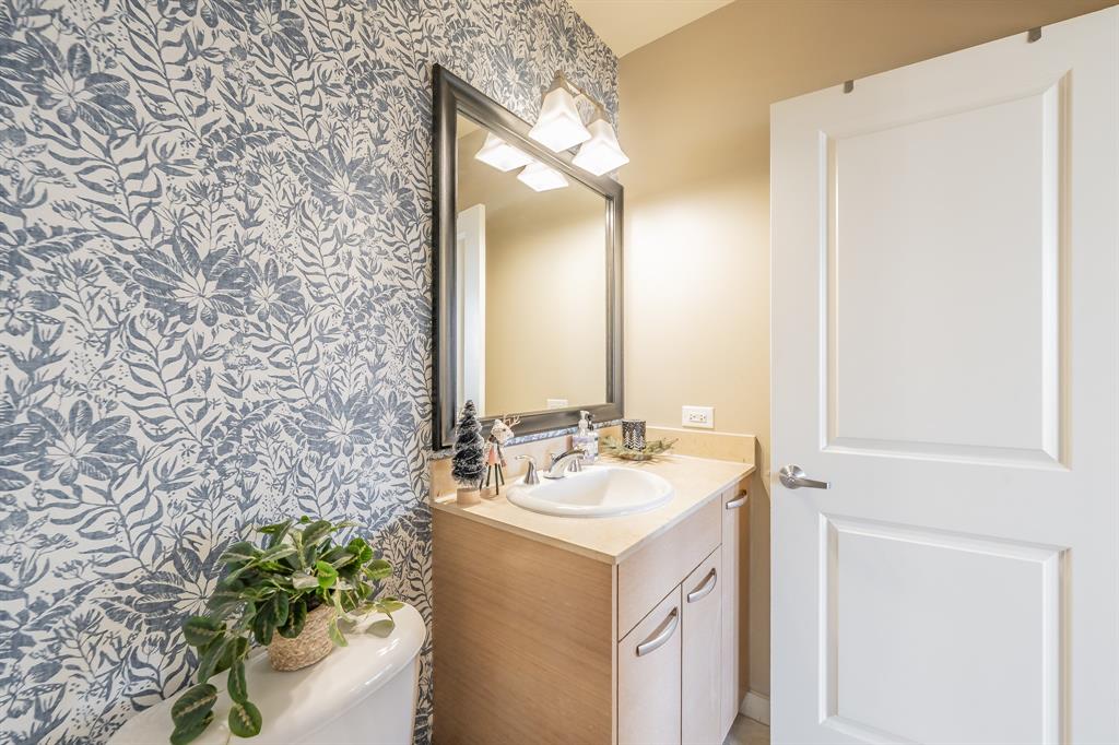 1200 Main Street, Unit 306 Dallas, TX 75202 - Photo 26 of 35 a bathroom with a sink and a mirror