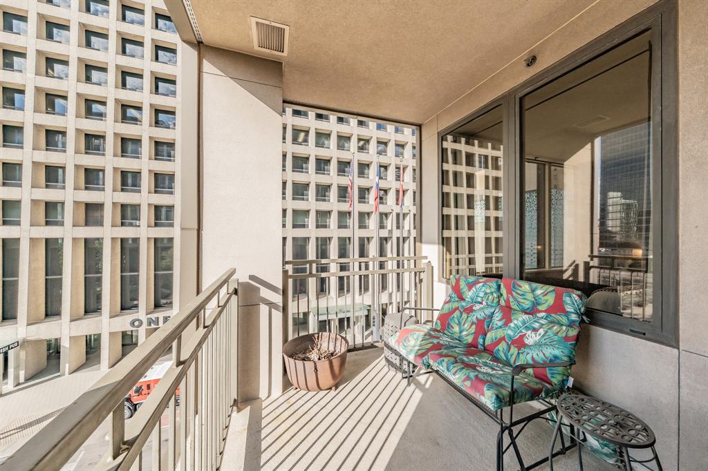 1200 Main Street, Unit 306 Dallas, TX 75202 - Photo 28 of 35 a reading room with furniture and stairs