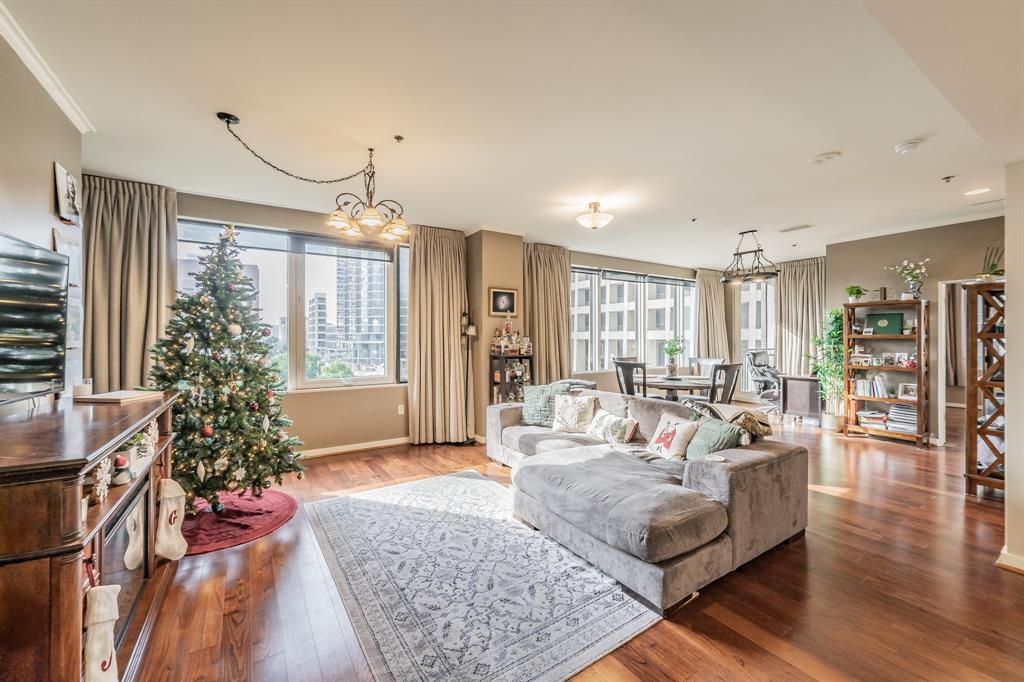 1200 Main Street, Unit 306 Dallas, TX 75202 - Photo 3 of 35 a living room with furniture and a large window