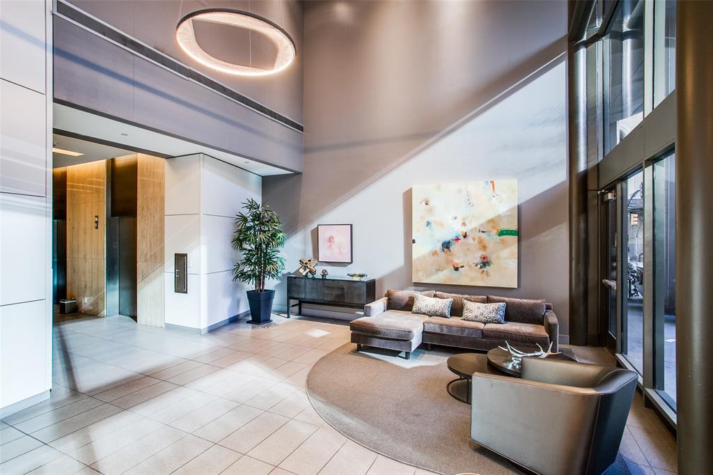 1200 Main Street, Unit 306 Dallas, TX 75202 - Photo 30 of 35 a living room with furniture fireplace and a large window