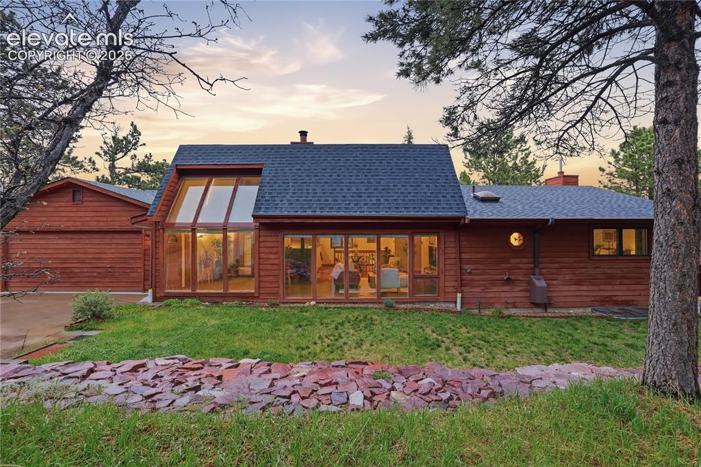 18190 Forest View Road Monument, CO 80132 - Photo 41 of 50 a front view of a house with a garden