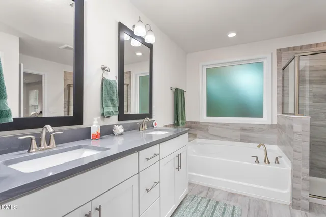 a bathroom with a glass shower door