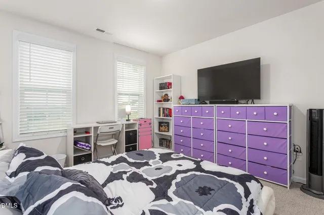 a bathroom with a shower and a window