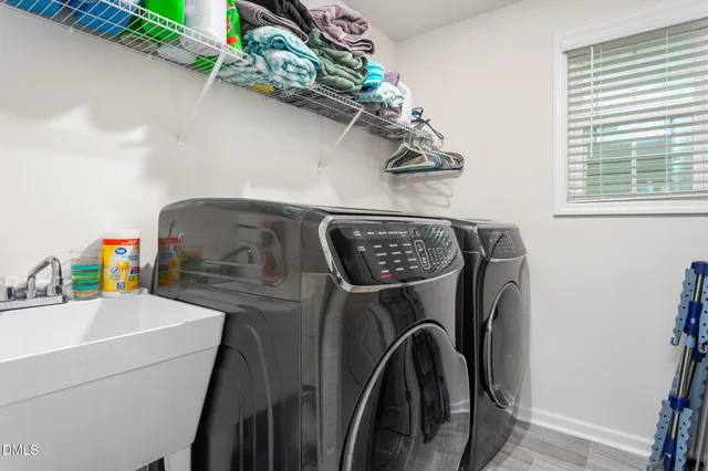 a view of a two chairs in the balcony