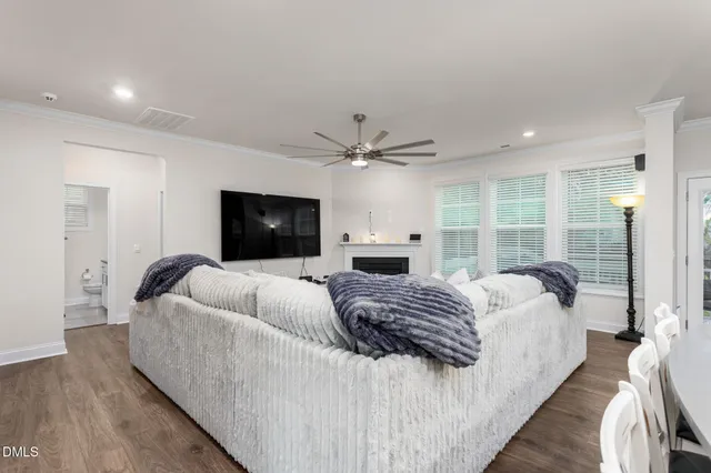 a large bedroom with a large bed and a large window