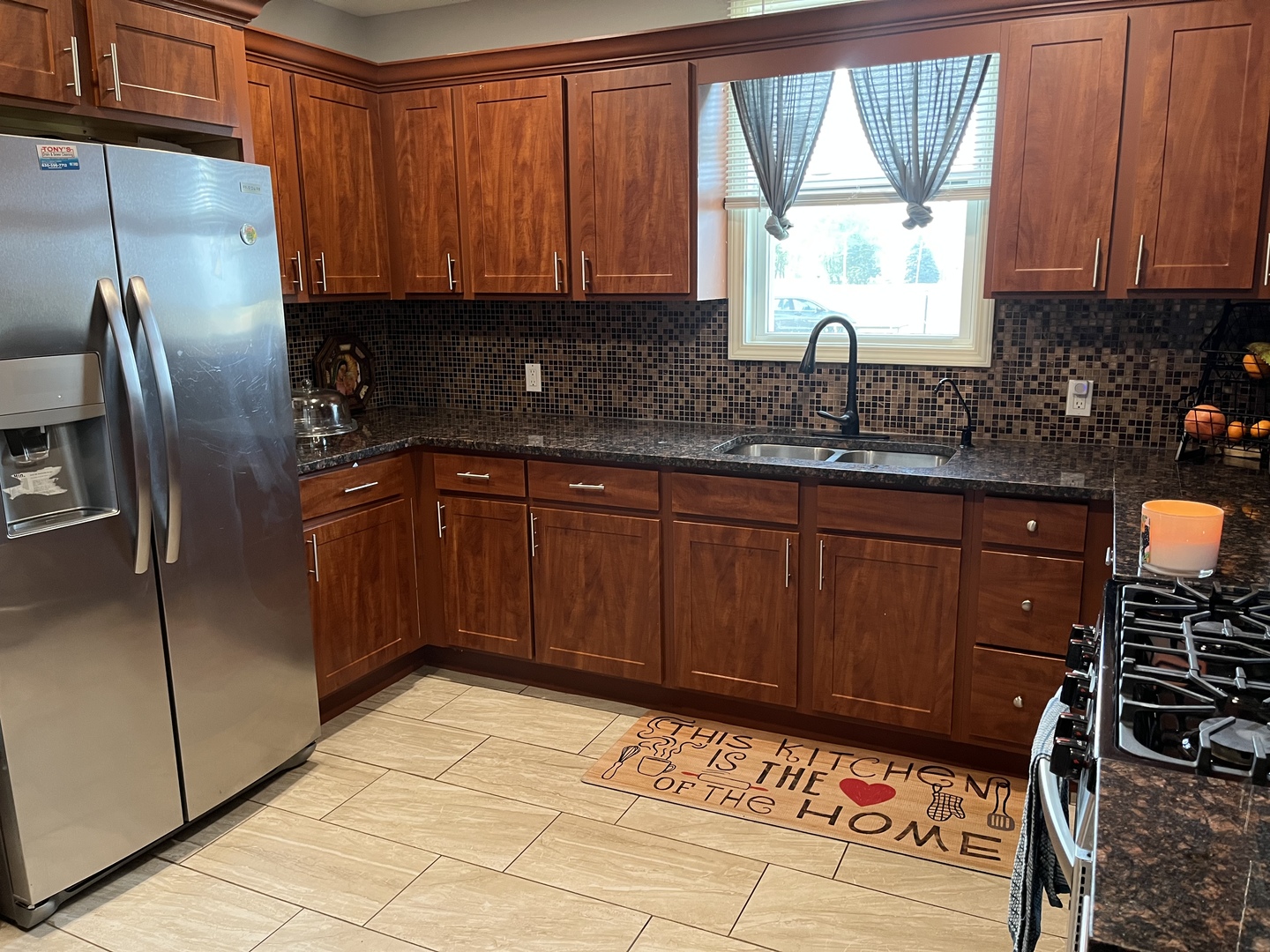 2990 Kane Road Leland, IL 60531 - Photo 8 of 42 a kitchen with stainless steel appliances granite countertop a sink stove and refrigerator