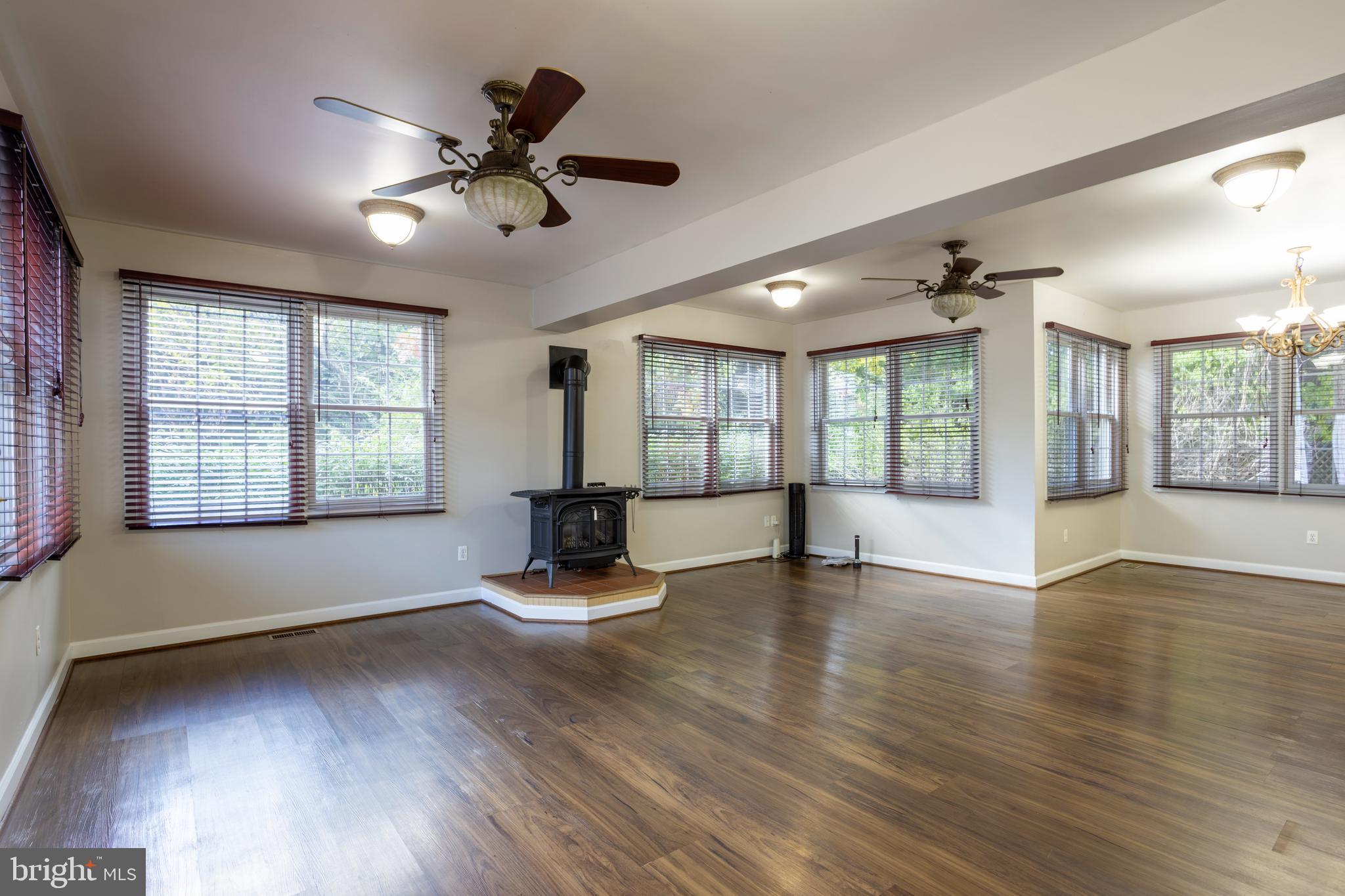 3306 Labyrinth Road Baltimore, MD 21215 - Photo 19 of 66 a view of an empty room with wooden floor and a window