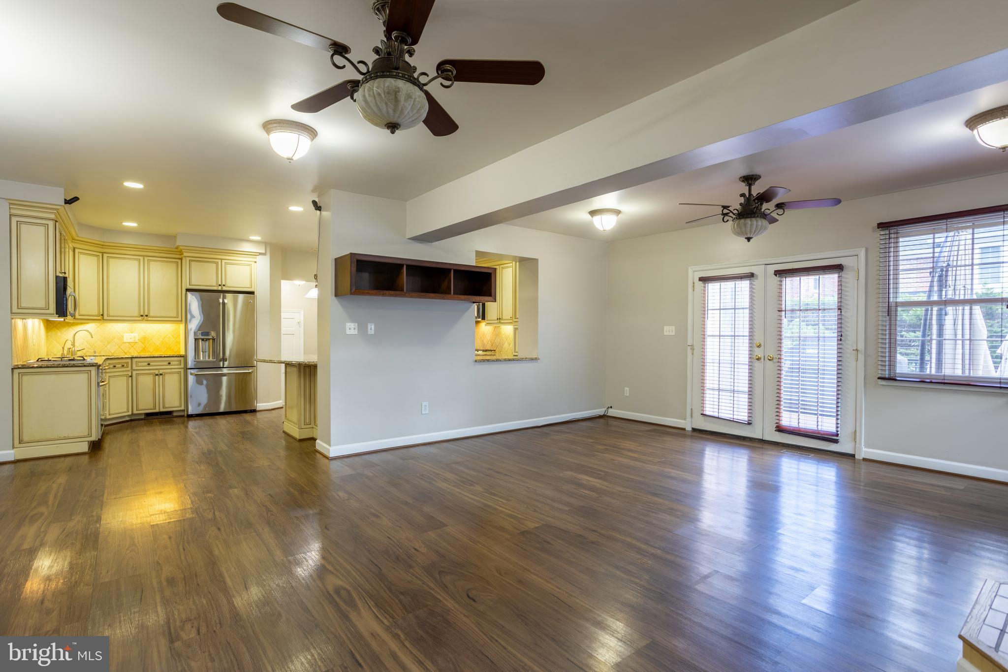 3306 Labyrinth Road Baltimore, MD 21215 - Photo 21 of 66 a view of an empty room with window and wooden floor