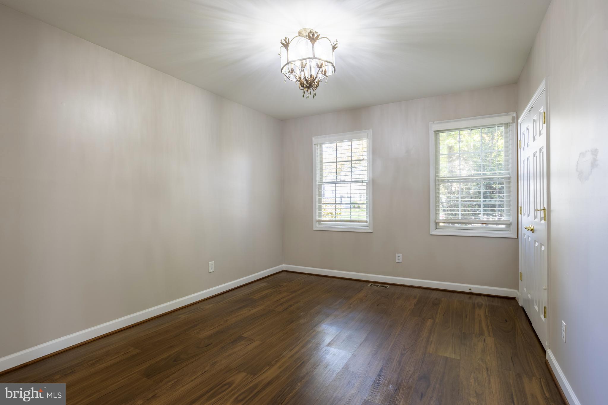 3306 Labyrinth Road Baltimore, MD 21215 - Photo 24 of 66 wooden floor in an empty room with a window