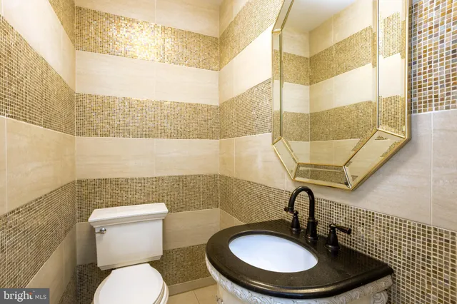 a bath tub sitting next to a white toilet