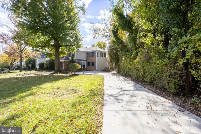 a house with trees in front of it