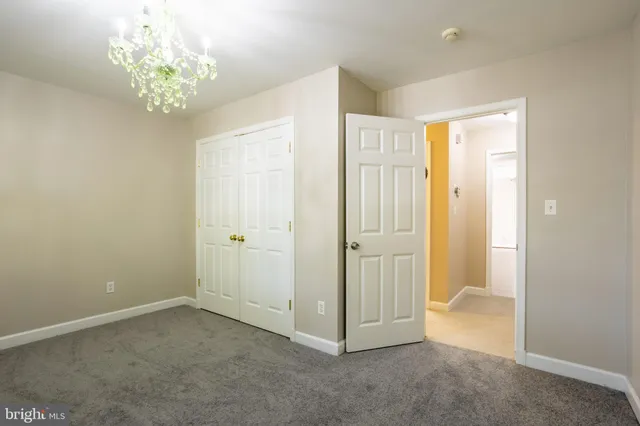a view of an empty room with wooden walls