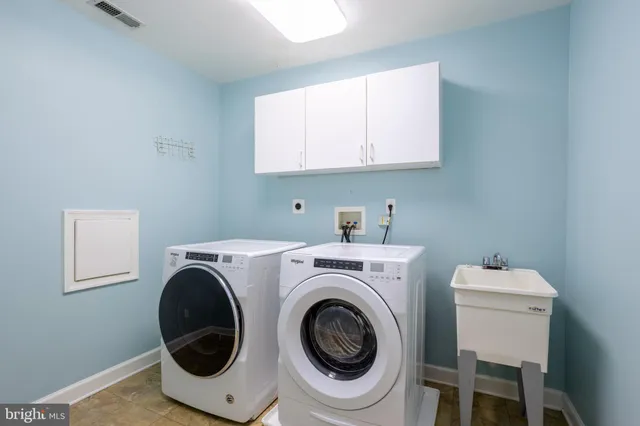 a kitchen with stainless steel appliances granite countertop a sink and cabinets