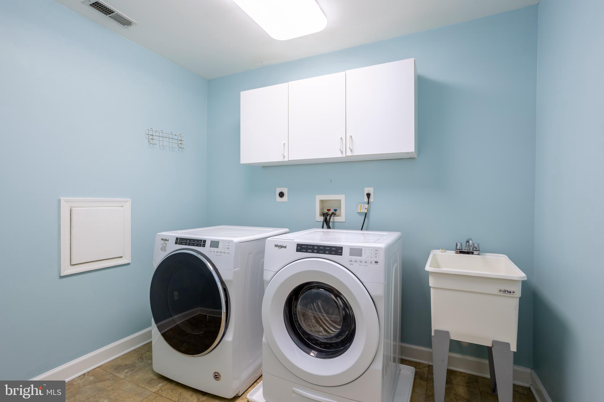 3306 Labyrinth Road Baltimore, MD 21215 - Photo 44 of 66 a utility room with dryer and washer