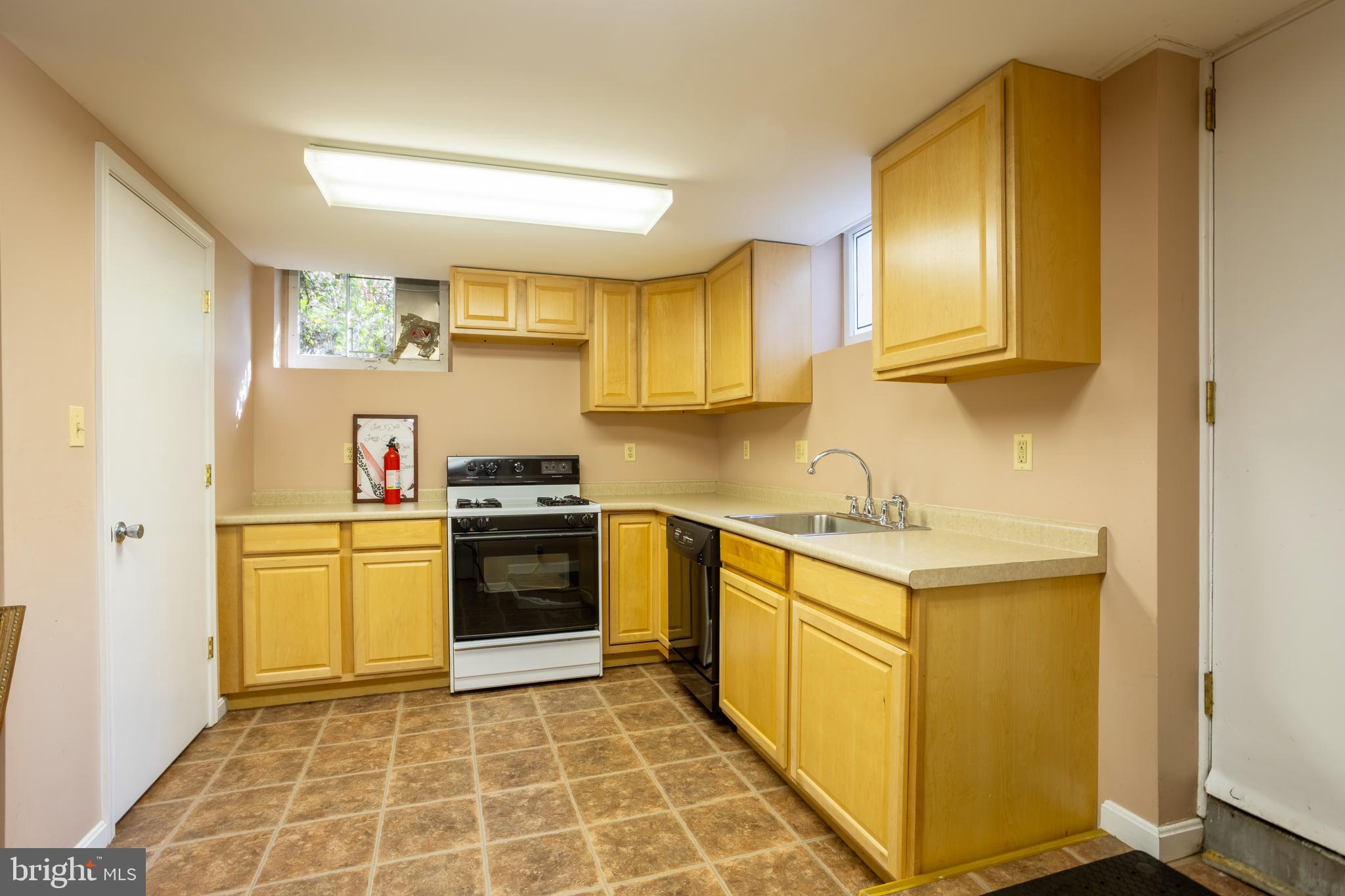 3306 Labyrinth Road Baltimore, MD 21215 - Photo 56 of 66 a kitchen with stainless steel appliances granite countertop a sink and cabinets