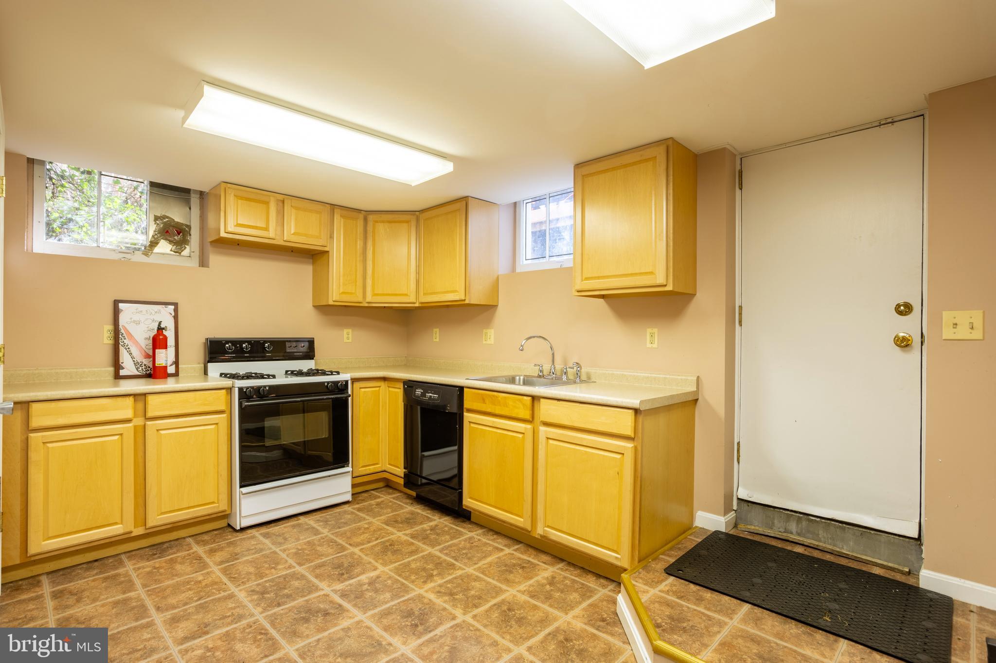 3306 Labyrinth Road Baltimore, MD 21215 - Photo 57 of 66 a kitchen with stainless steel appliances granite countertop a stove a sink and a refrigerator