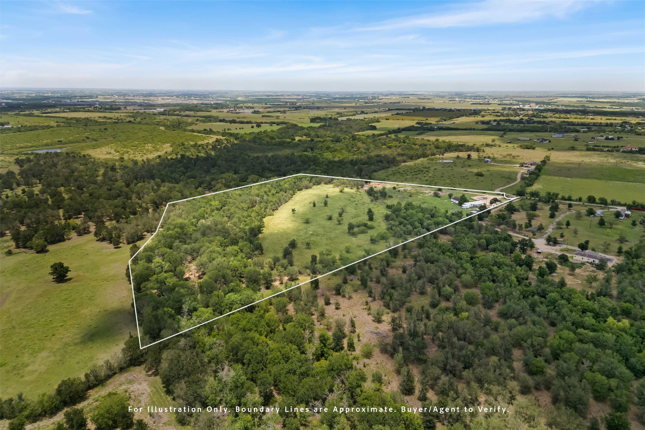 12212 Ballerstedt Road Elgin, TX 78621 - Photo 39 of 39 Aerial view of sparsely populated area with a heavily wooded area and property boundaries highlighted
