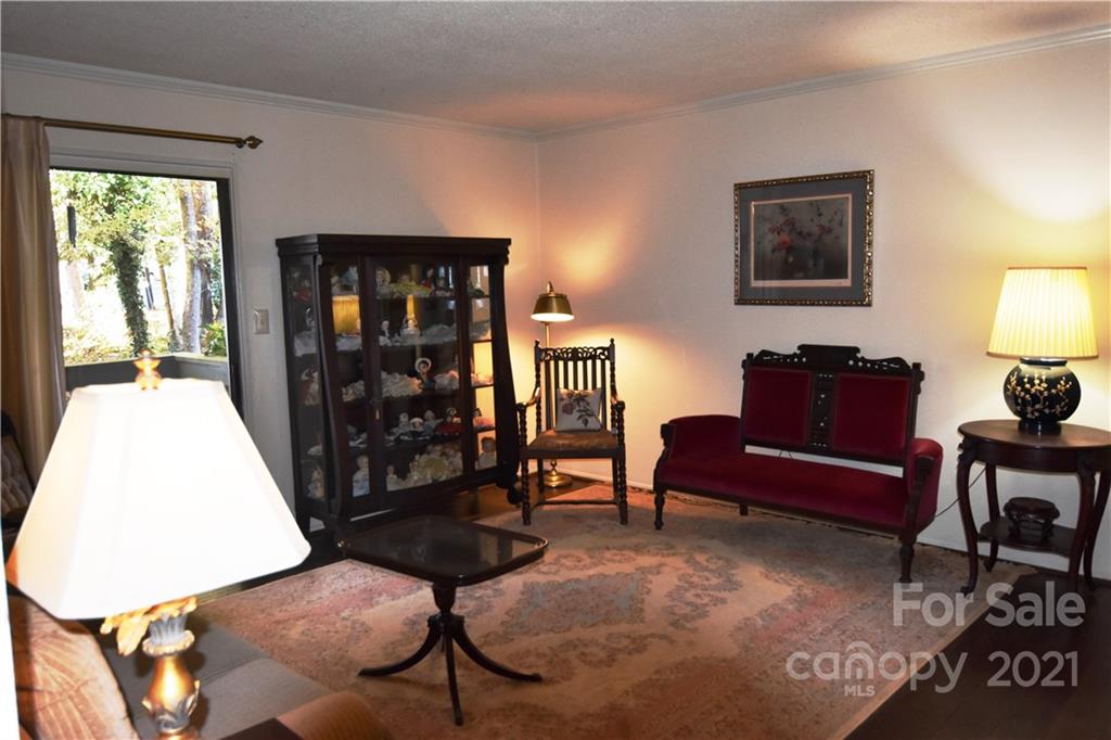 4906 Sardis Road, Unit E Charlotte, NC 28270 - Photo 2 of 24 a living room with furniture and a window