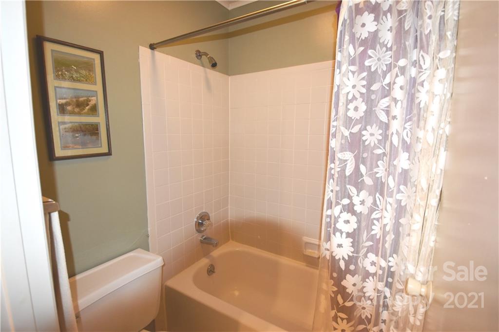 4906 Sardis Road, Unit E Charlotte, NC 28270 - Photo 22 of 24 a bathroom with a bathtub and shower
